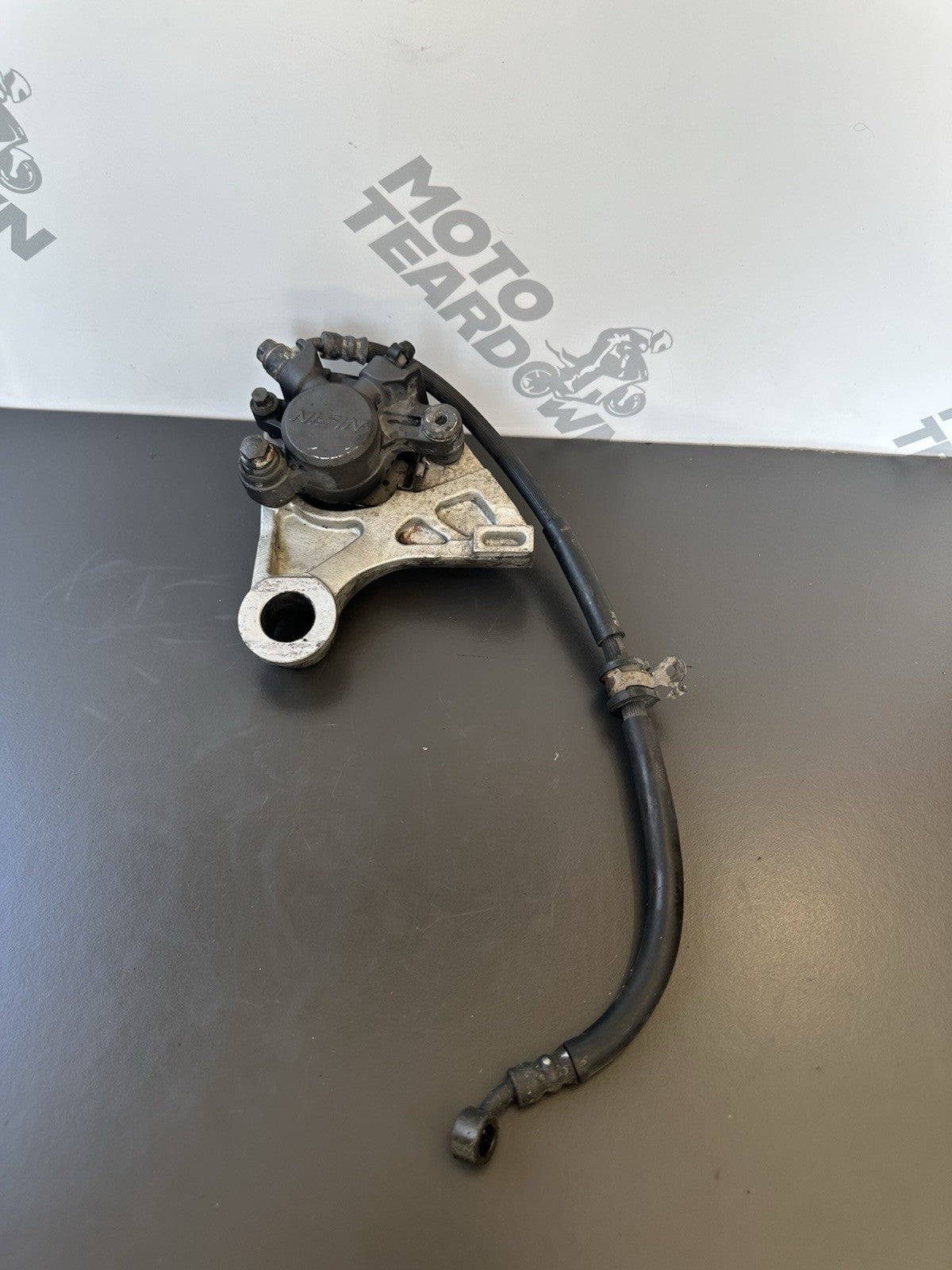 HONDA CBR1000RR REAR BRAKE CALIPER WITH BRACKET 2004 2005 RR4 RR5 CBR1000RR OEM