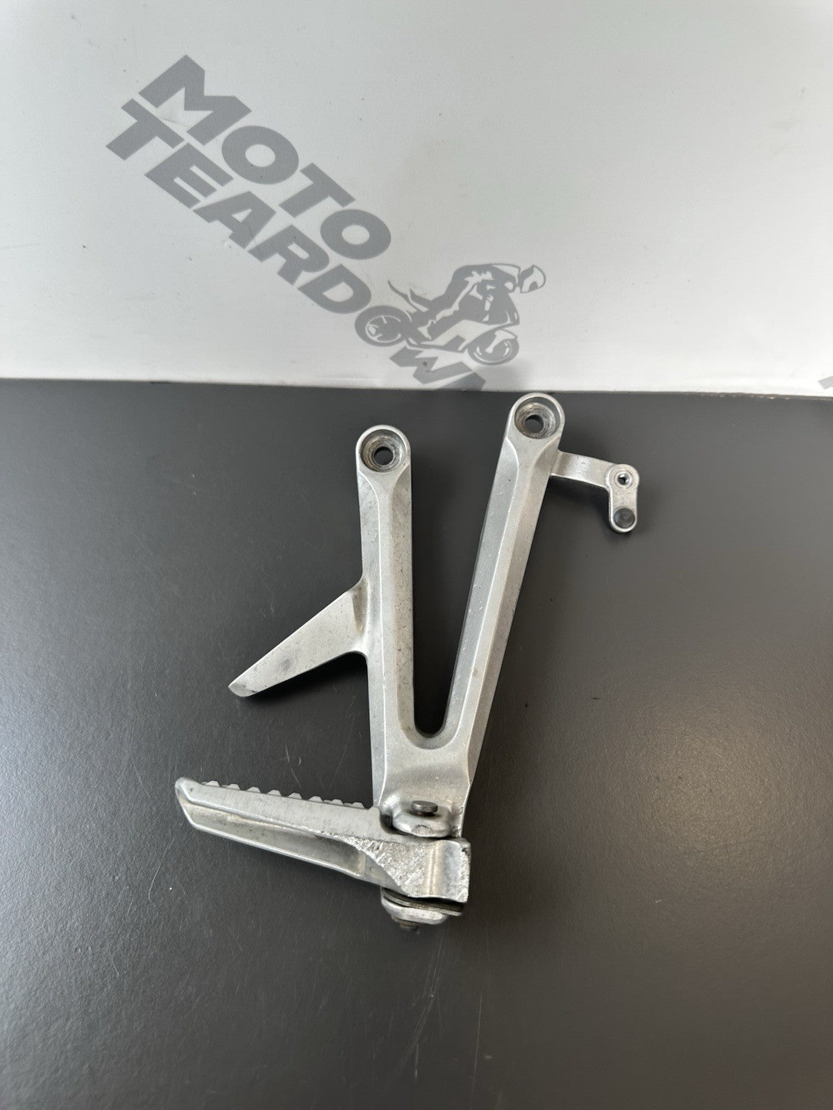 Honda CBR1000RR Fireblade right pillion footrest Right Foot Hanger 2004-2005 OEM