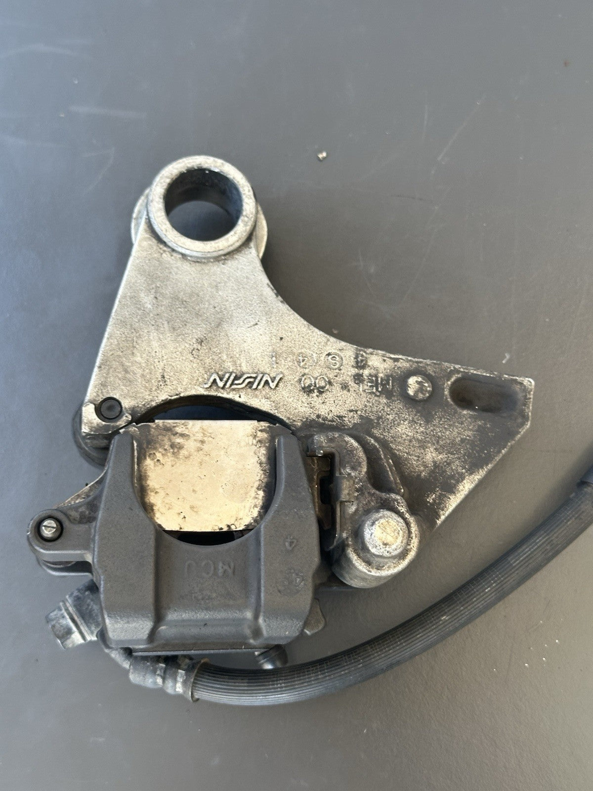 HONDA CBR1000RR REAR BRAKE CALIPER WITH BRACKET 2004 2005 RR4 RR5 CBR1000RR OEM