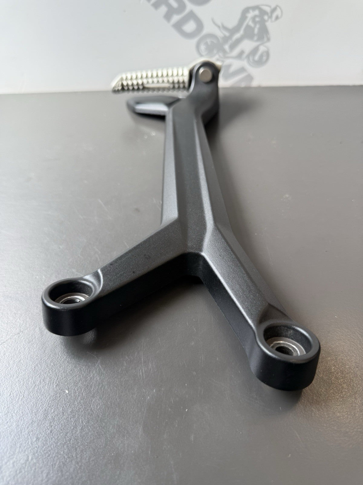 TRIUMPH TRIDENT 660 Left Rear Footrest Hanger - T2086605 2021-2024 Left Footrest