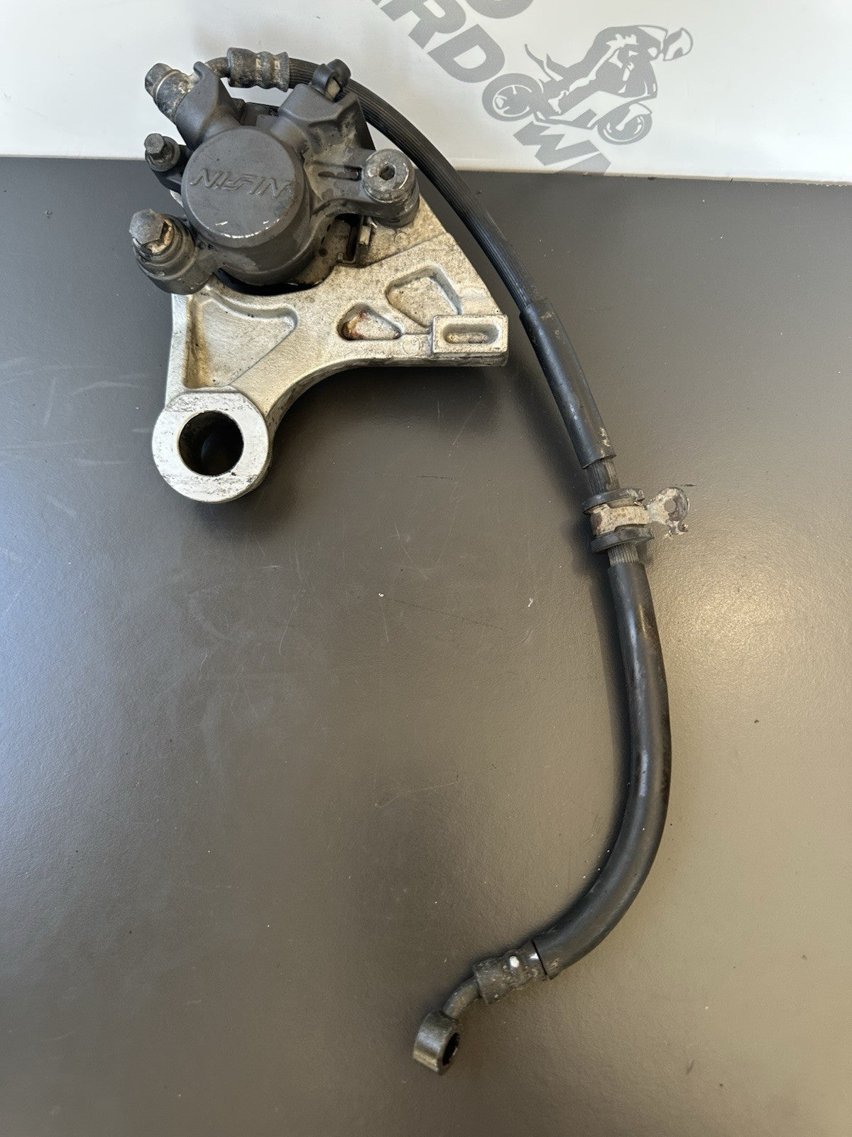 HONDA CBR1000RR REAR BRAKE CALIPER WITH BRACKET 2004 2005 RR4 RR5 CBR1000RR OEM