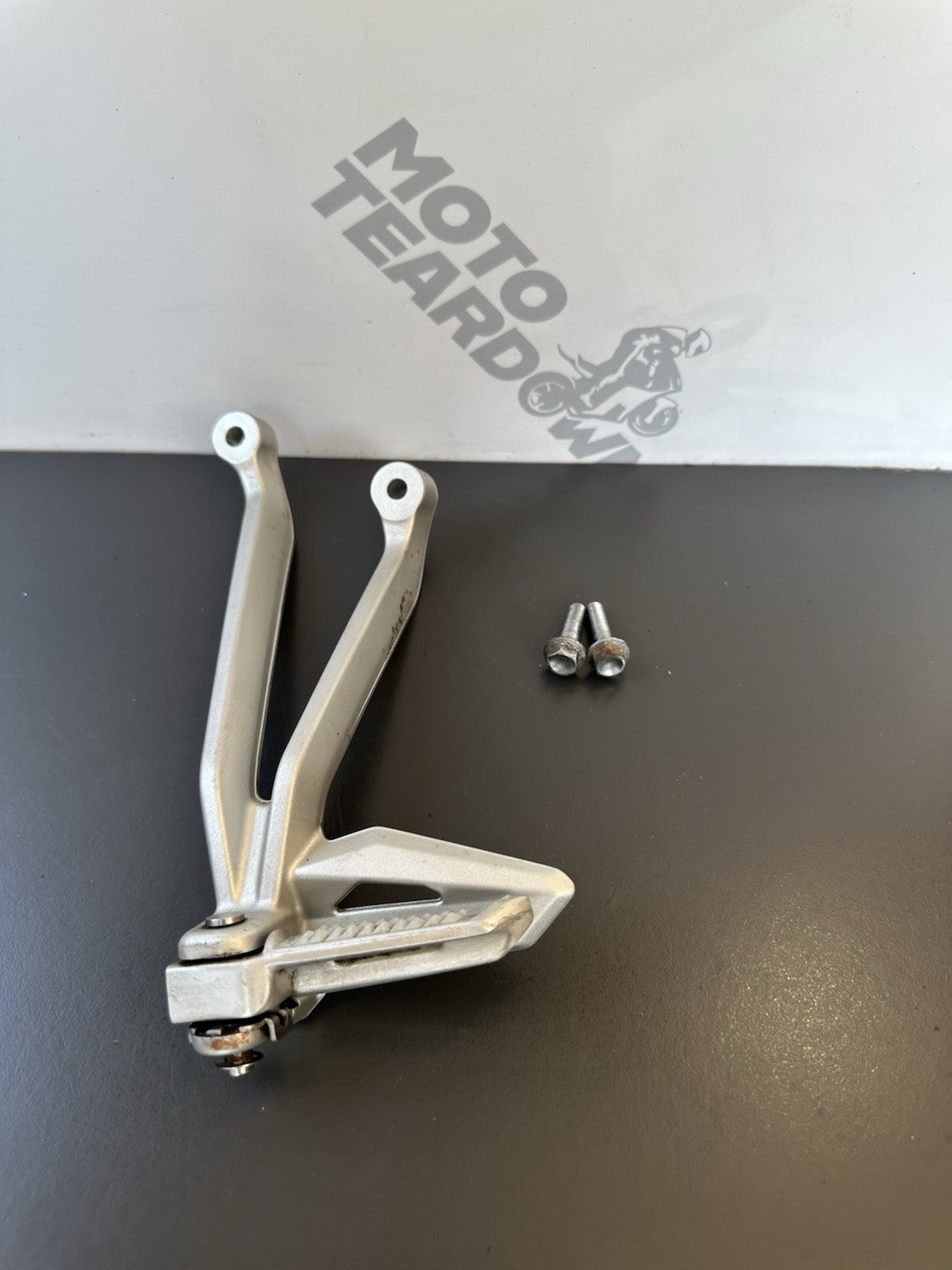 TRIUMPH STREET TRIPLE Left Pillion Footrest Hanger - 765R 765RS T2081987 2017-19