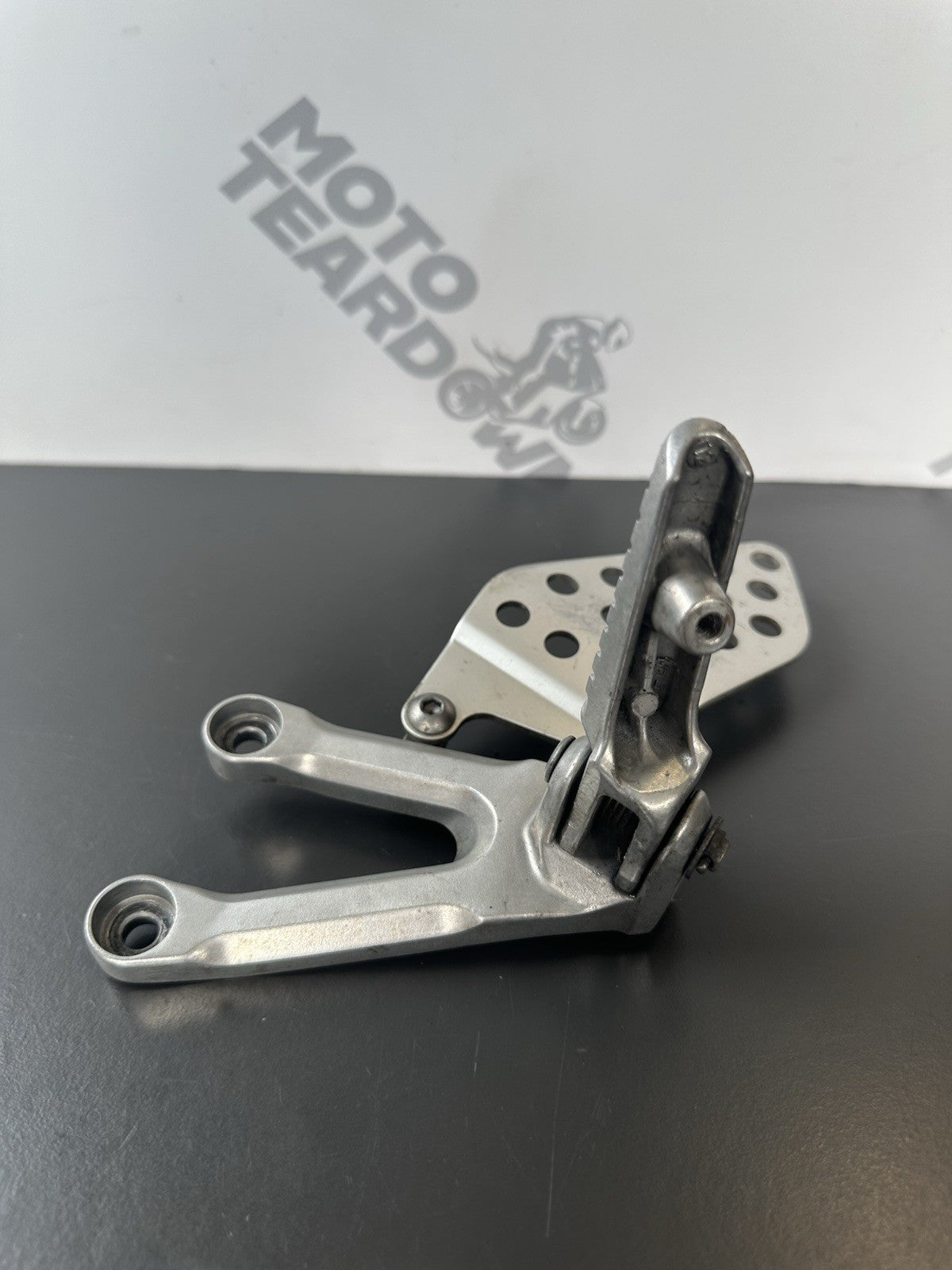 Honda CBR1000RR fireblade left front footrest hanger bracket peg 2004 - 2005 OEM