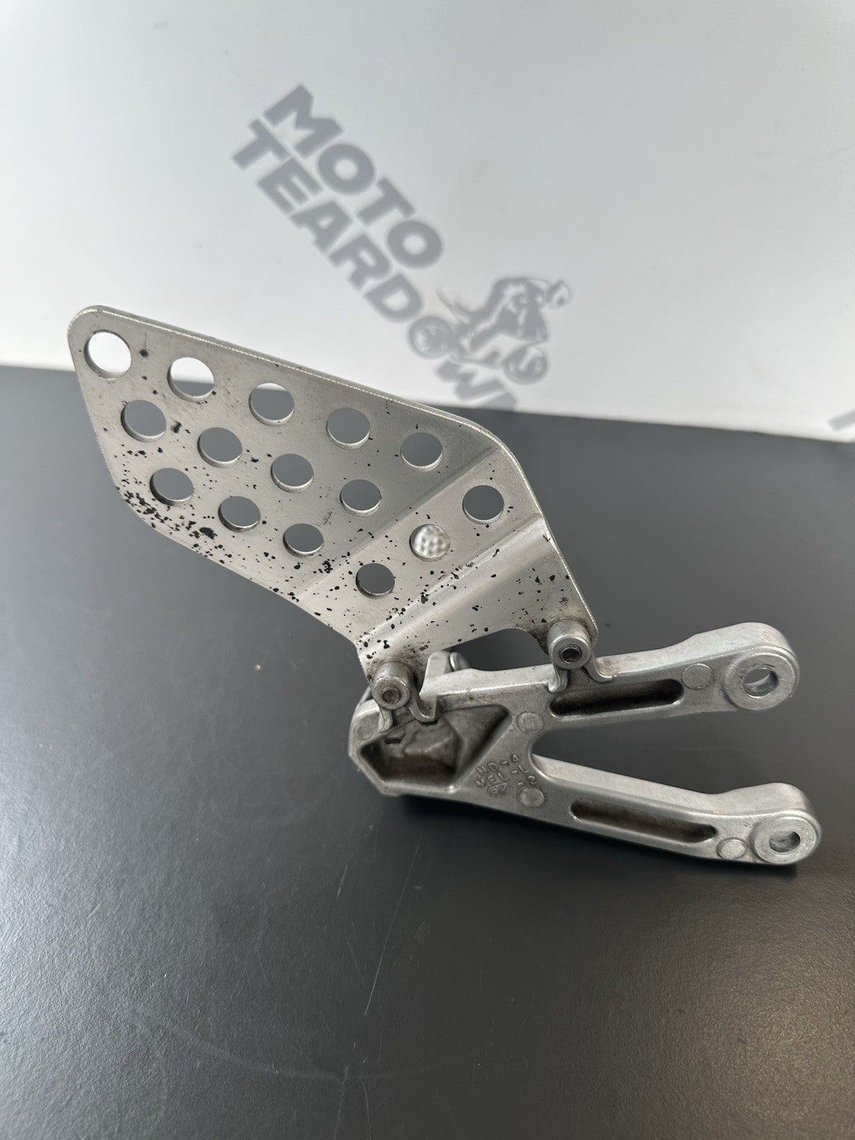 Honda CBR1000RR fireblade left front footrest hanger bracket peg 2004 - 2005 OEM