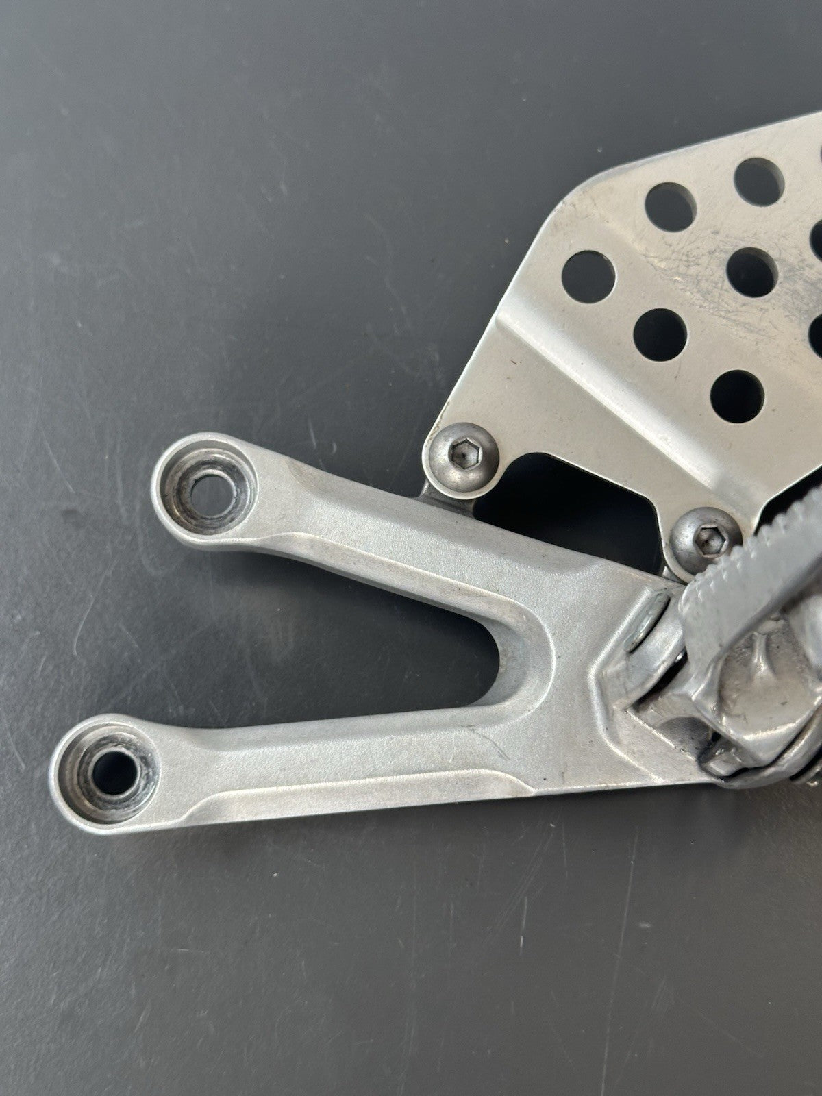 Honda CBR1000RR fireblade left front footrest hanger bracket peg 2004 - 2005 OEM