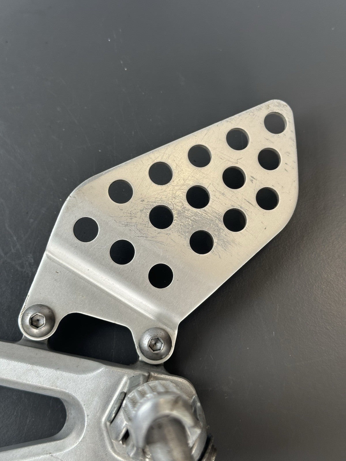 Honda CBR1000RR fireblade left front footrest hanger bracket peg 2004 - 2005 OEM