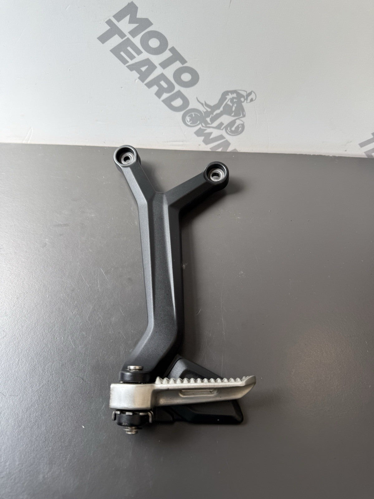 TRIUMPH TRIDENT 660 Left Rear Footrest Hanger - T2086605 2021-2024 Left Footrest