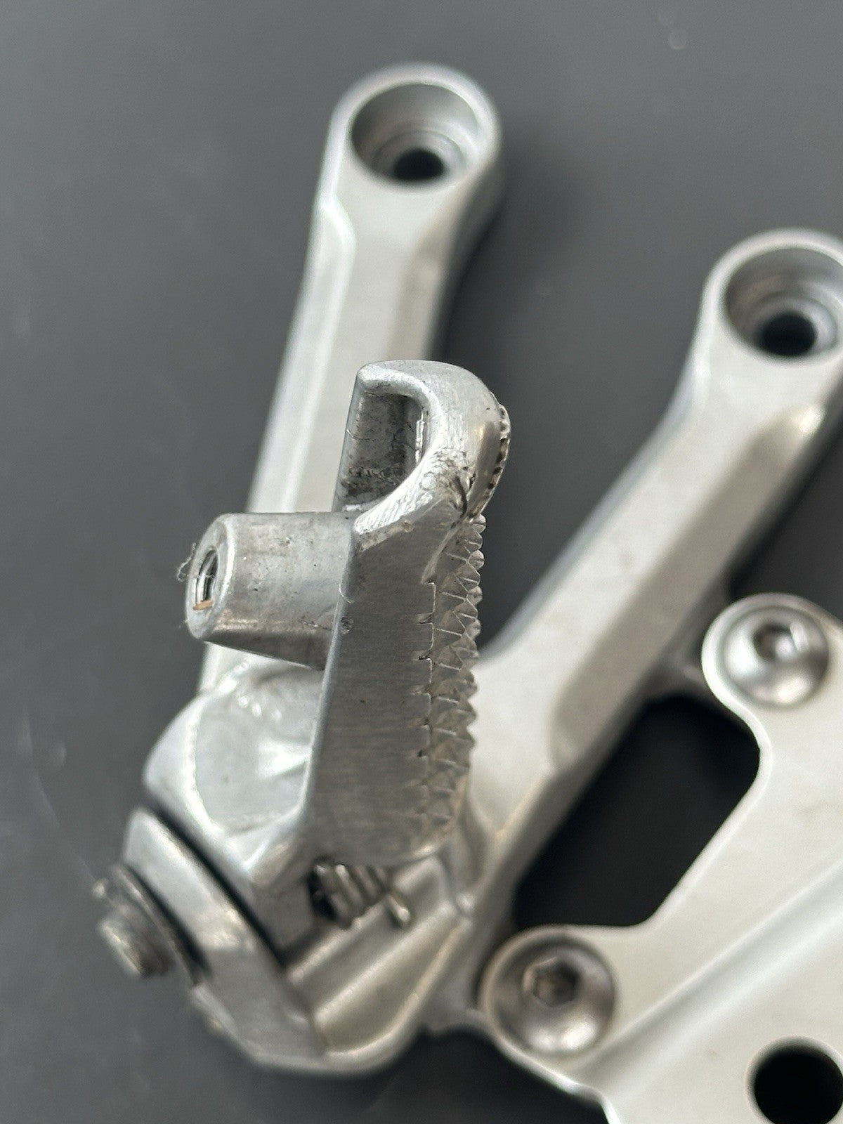 Honda CBR1000RR fireblade left front footrest hanger bracket peg 2004 - 2005 OEM