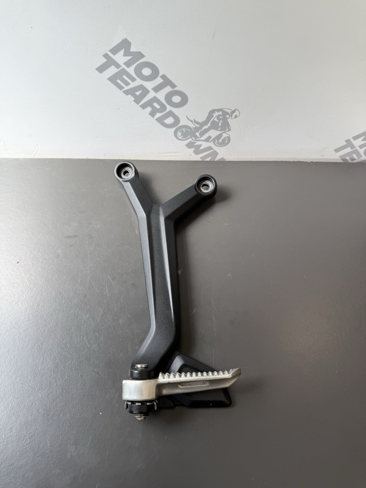 TRIUMPH TRIDENT 660 Left Rear Footrest Hanger - T2086605 2021-2024 Left Footrest