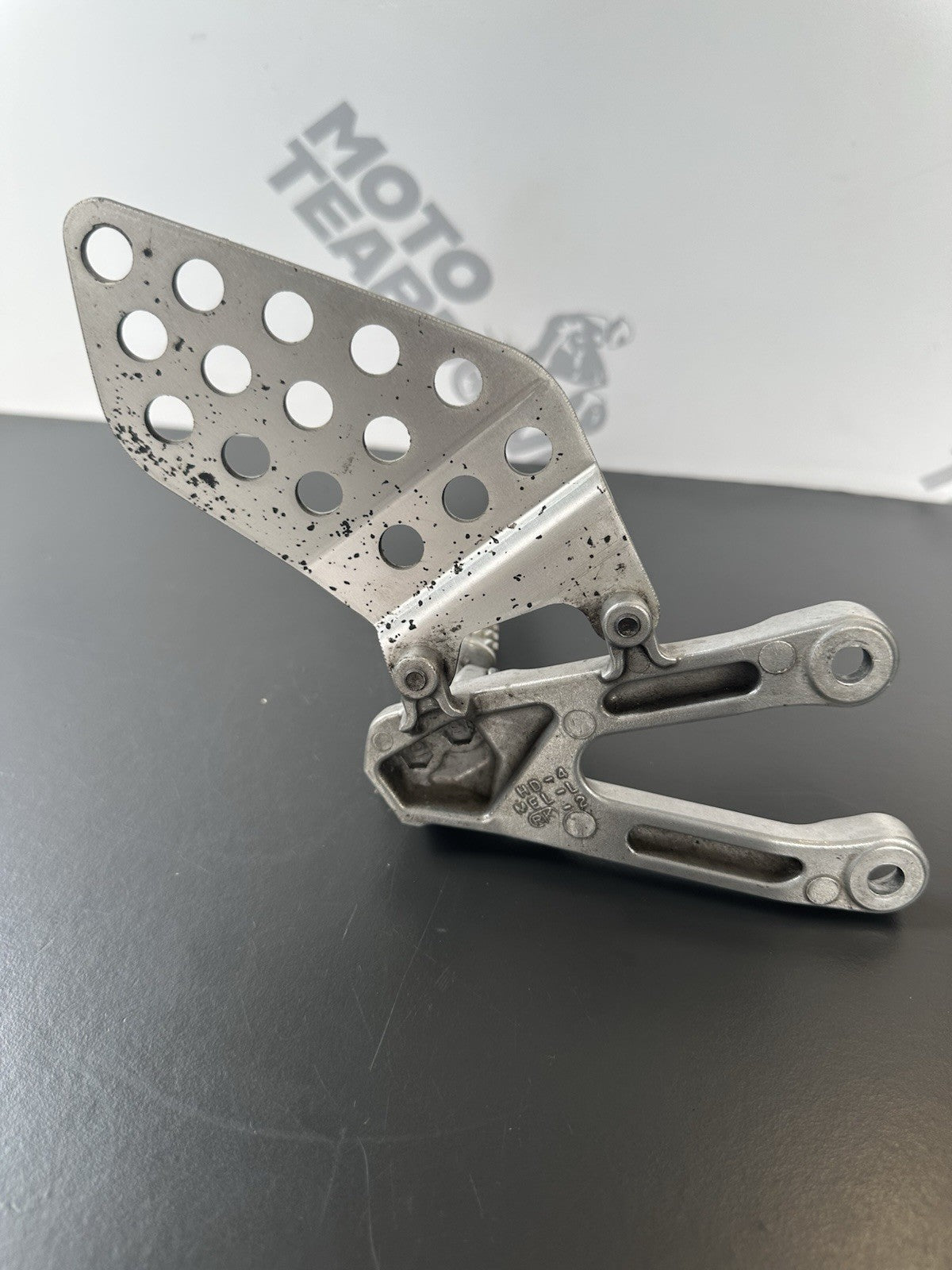 Honda CBR1000RR fireblade left front footrest hanger bracket peg 2004 - 2005 OEM