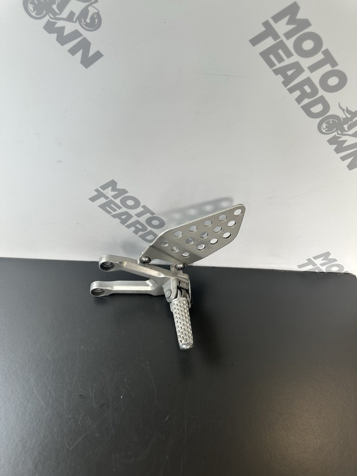 Honda CBR1000RR fireblade left front footrest hanger bracket peg 2004 - 2005 OEM