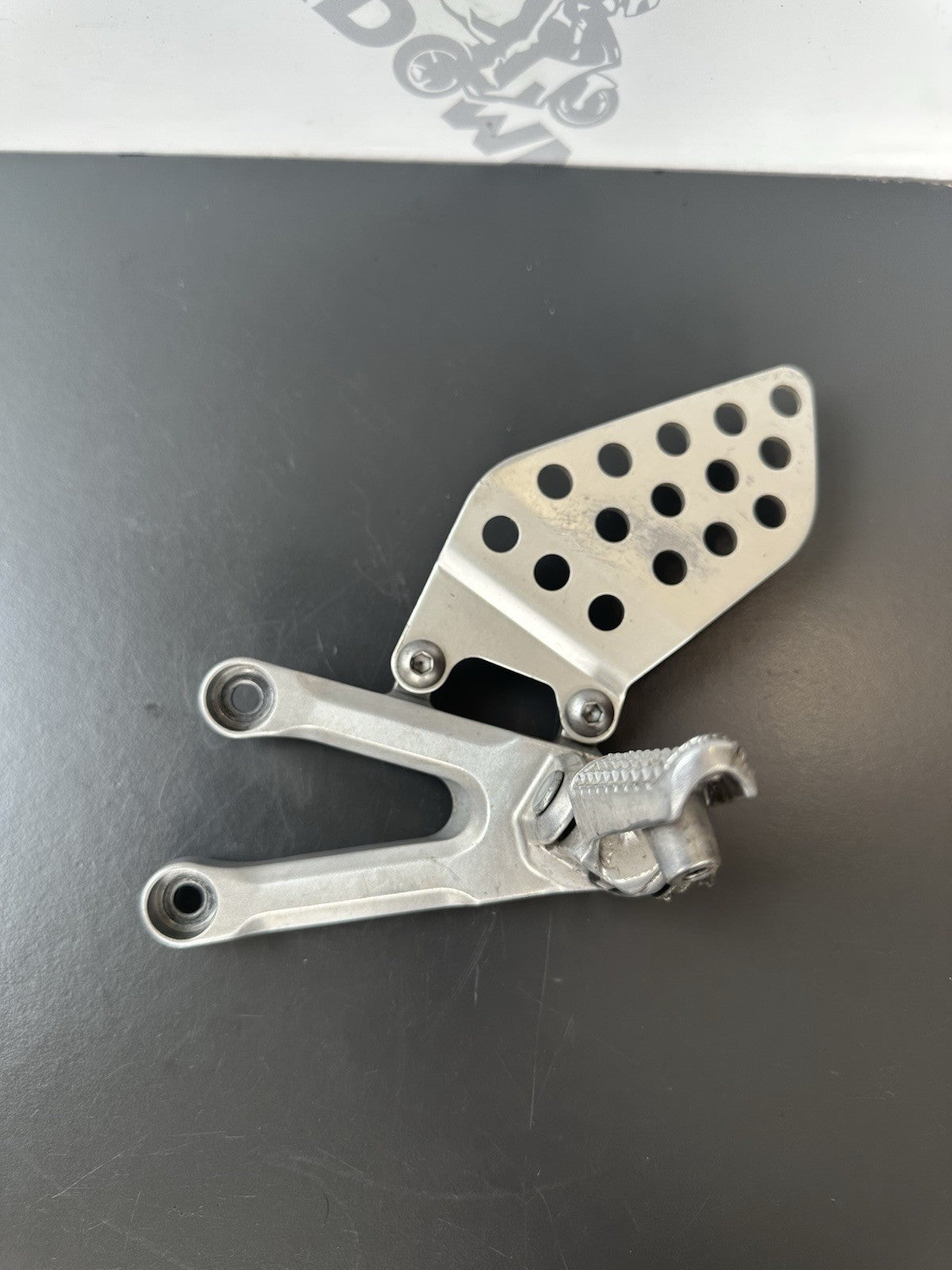 Honda CBR1000RR fireblade left front footrest hanger bracket peg 2004 - 2005 OEM