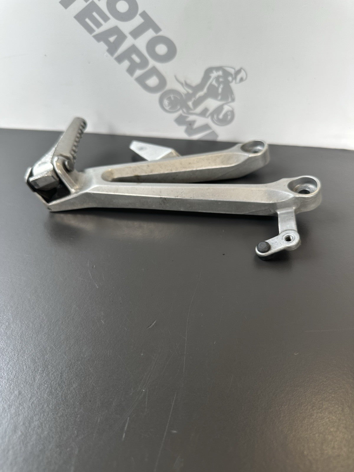 Honda CBR1000RR Fireblade right pillion footrest Right Foot Hanger 2004-2005 OEM