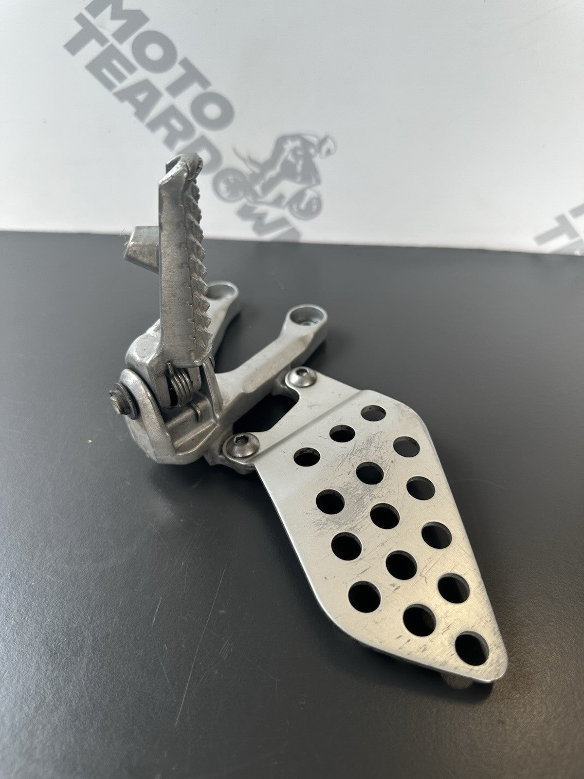 Honda CBR1000RR fireblade left front footrest hanger bracket peg 2004 - 2005 OEM