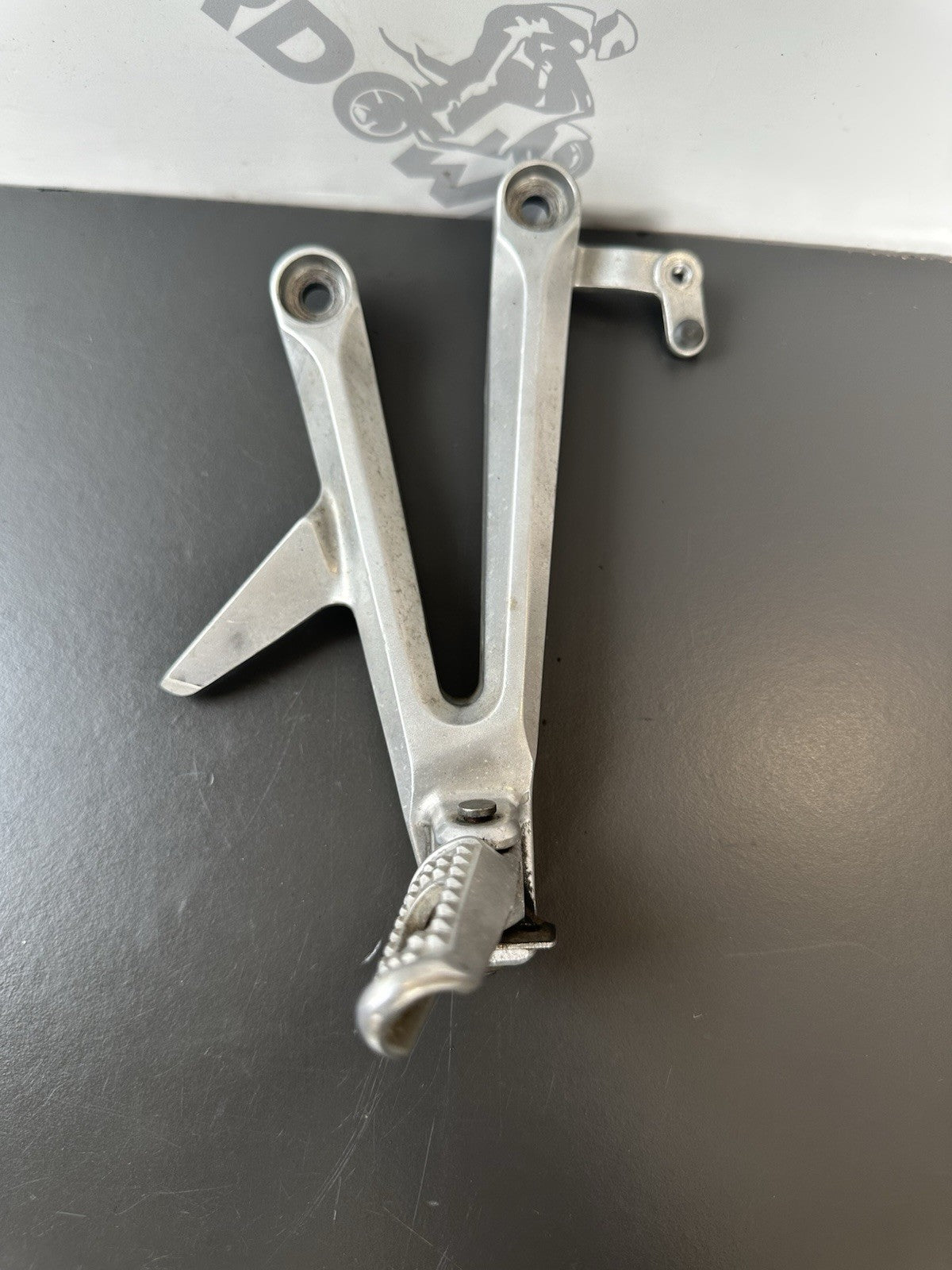 Honda CBR1000RR Fireblade right pillion footrest Right Foot Hanger 2004-2005 OEM