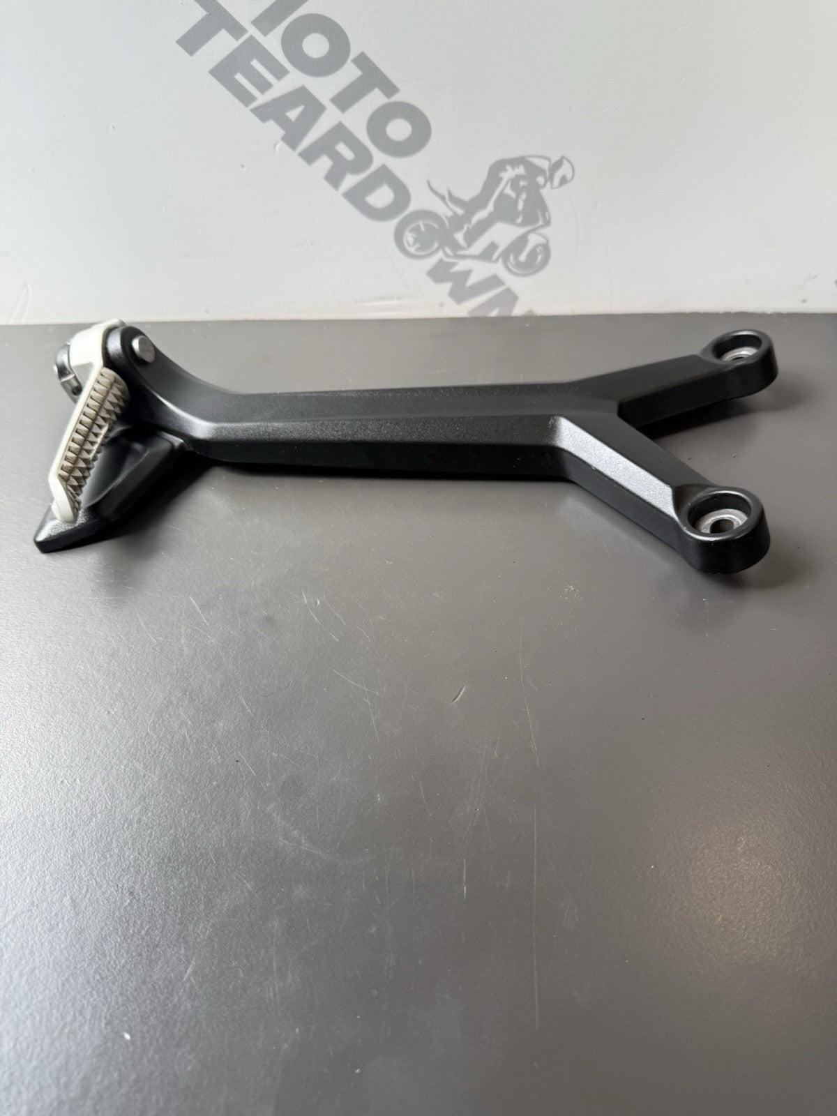 TRIUMPH TRIDENT 660 Left Rear Footrest Hanger - T2086605 2021-2024 Left Footrest