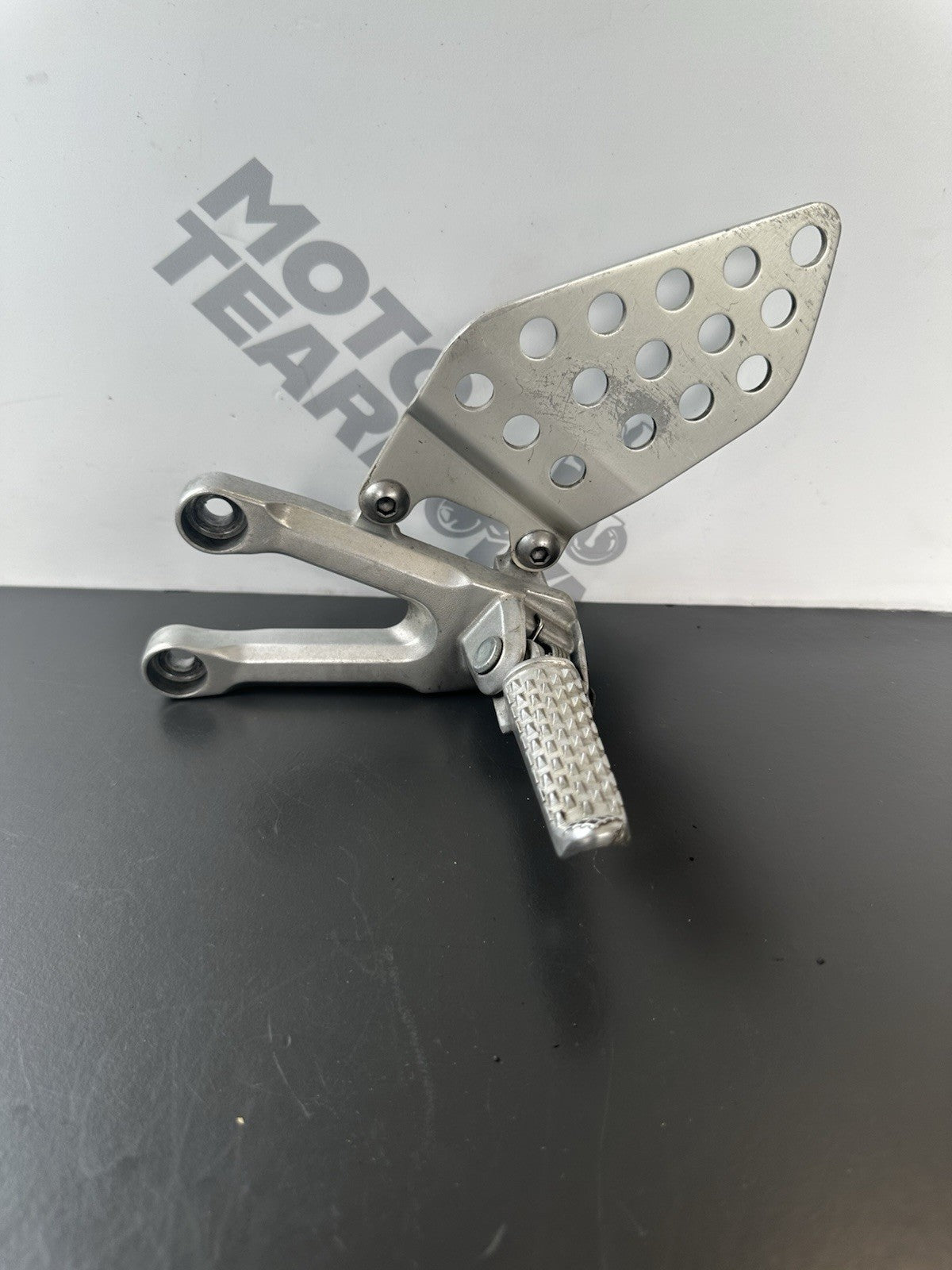 Honda CBR1000RR fireblade left front footrest hanger bracket peg 2004 - 2005 OEM