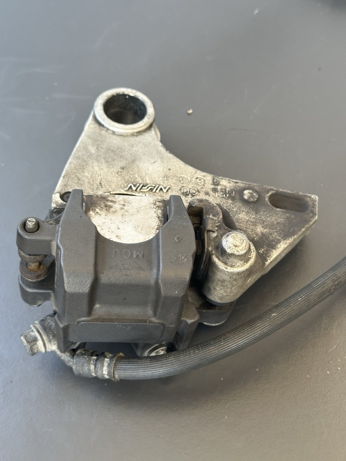 HONDA CBR1000RR REAR BRAKE CALIPER WITH BRACKET 2004 2005 RR4 RR5 CBR1000RR OEM