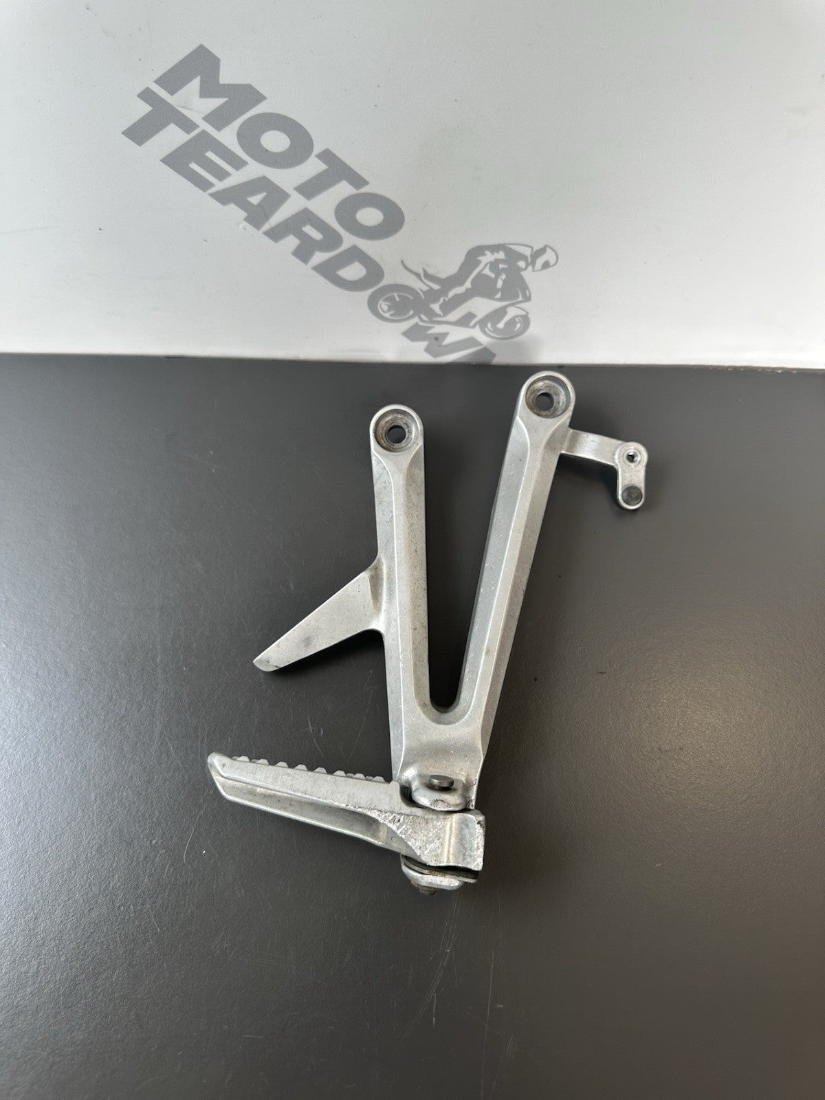Honda CBR1000RR Fireblade right pillion footrest Right Foot Hanger 2004-2005 OEM