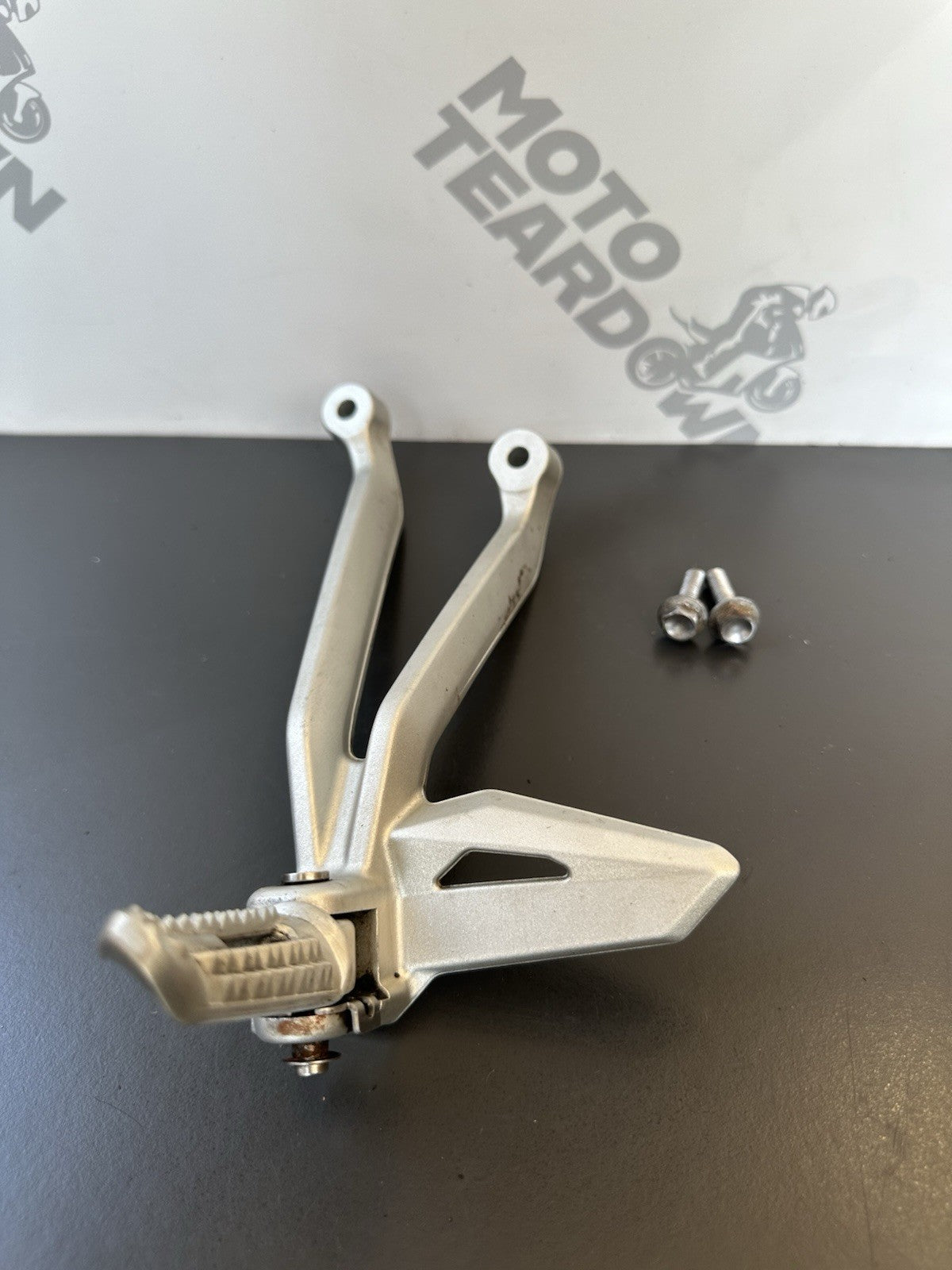 TRIUMPH STREET TRIPLE Left Pillion Footrest Hanger - 765R 765RS T2081987 2017-19