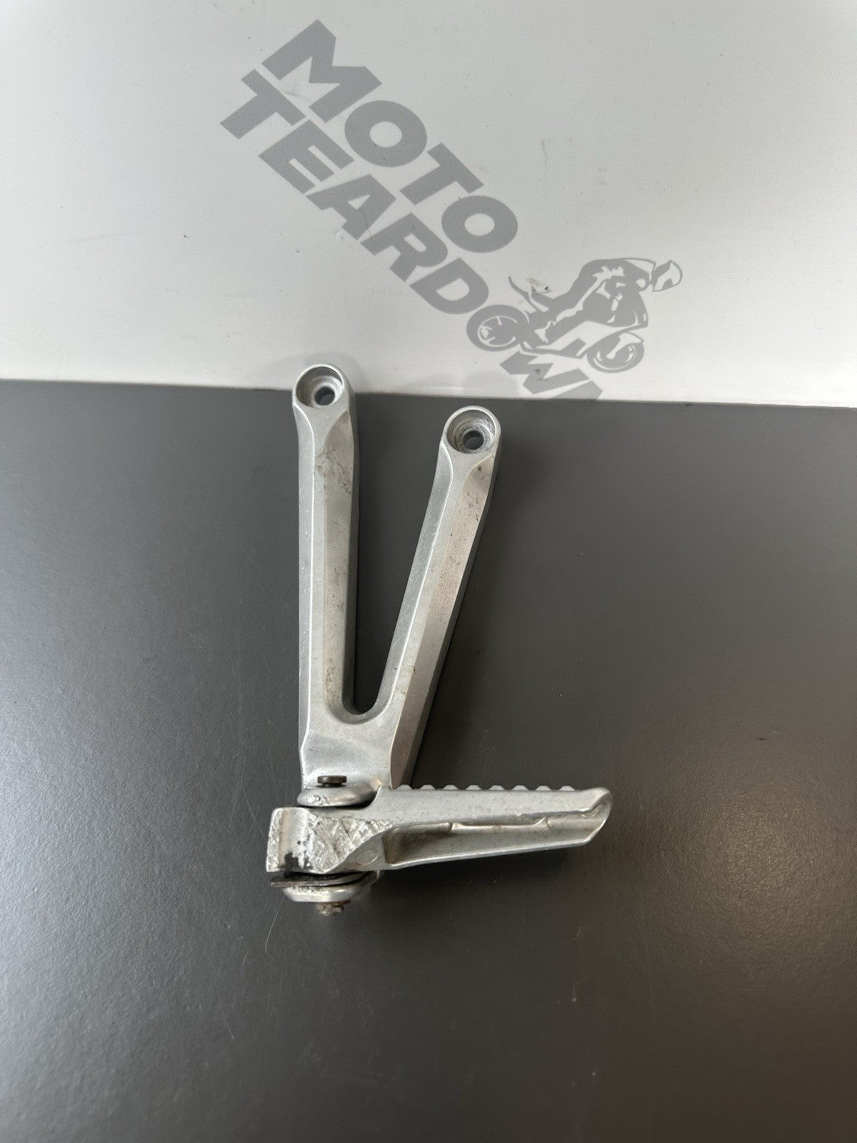 Honda CBR1000RR Fireblade Left pillion footrest Left Foot Hanger 2004-2005 OEM