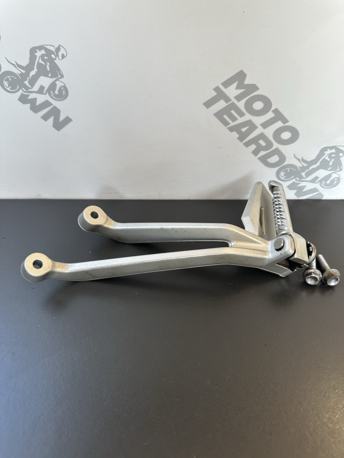 TRIUMPH STREET TRIPLE Left Pillion Footrest Hanger - 765R 765RS T2081987 2017-19