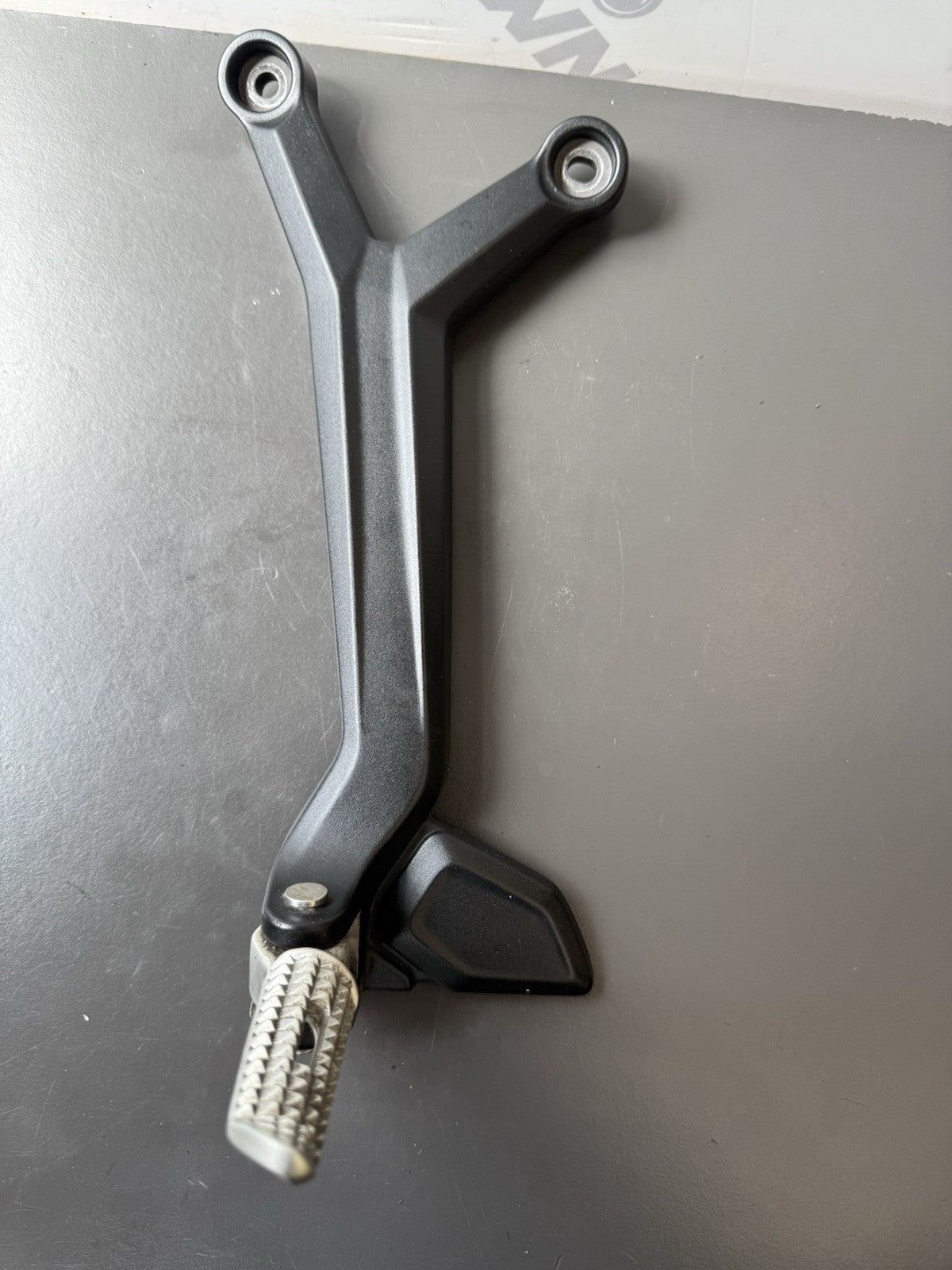 TRIUMPH TRIDENT 660 Left Rear Footrest Hanger - T2086605 2021-2024 Left Footrest