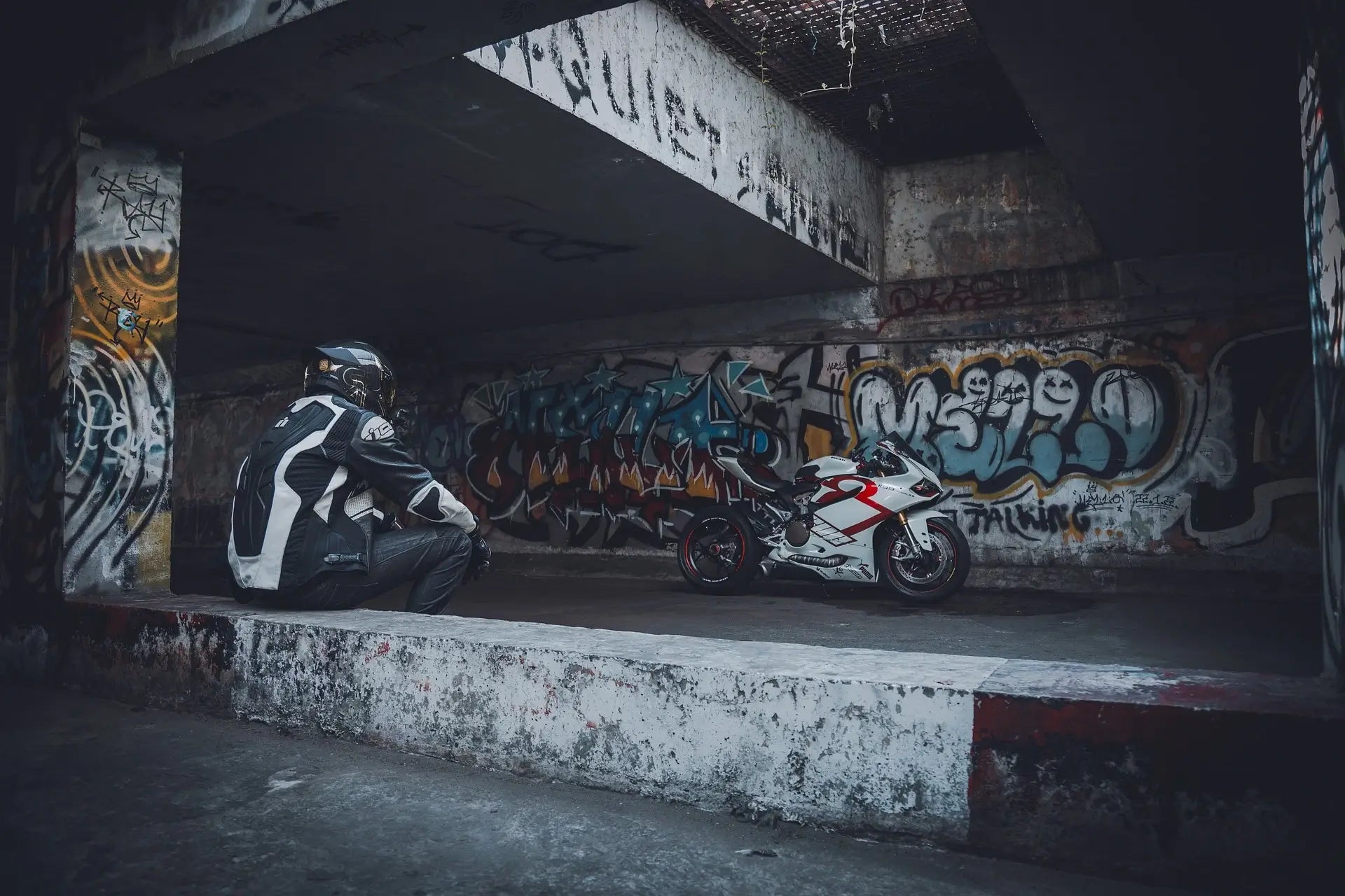 Man sat next to his Motorbike