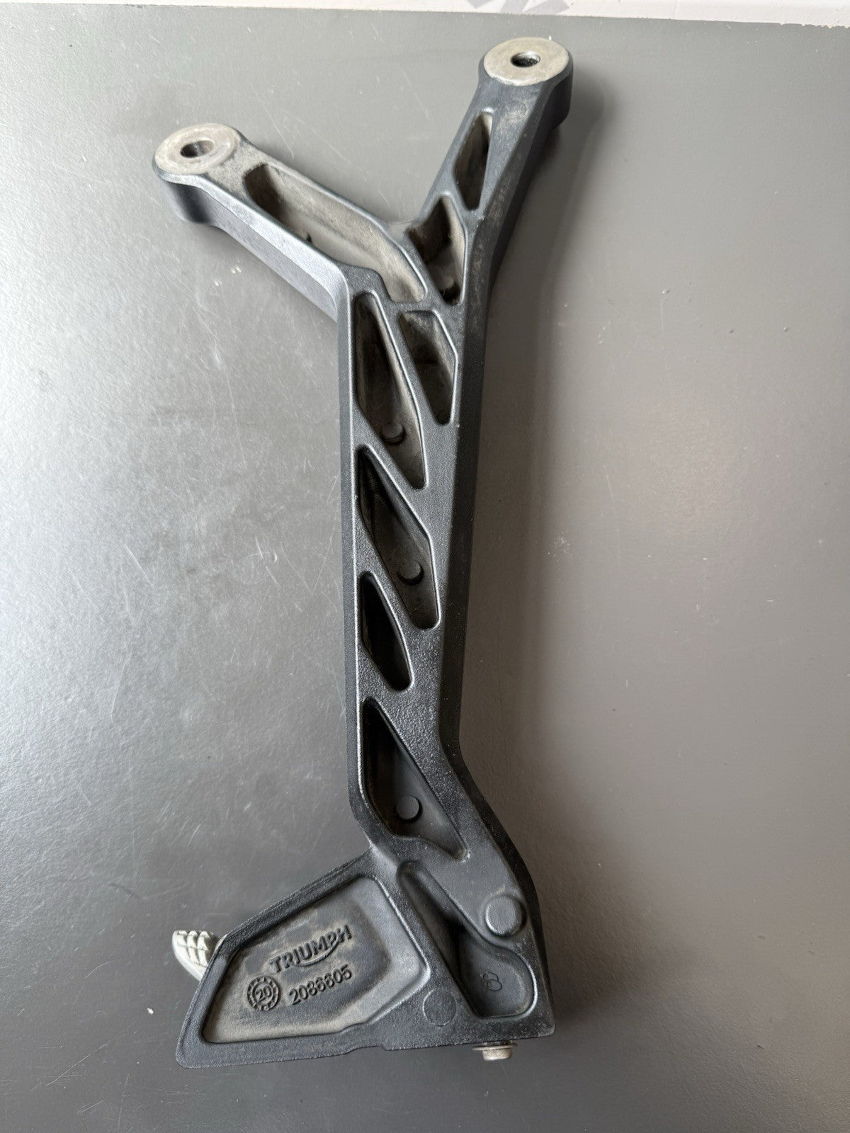 TRIUMPH TRIDENT 660 Left Rear Footrest Hanger - T2086605 2021-2024 Left Footrest