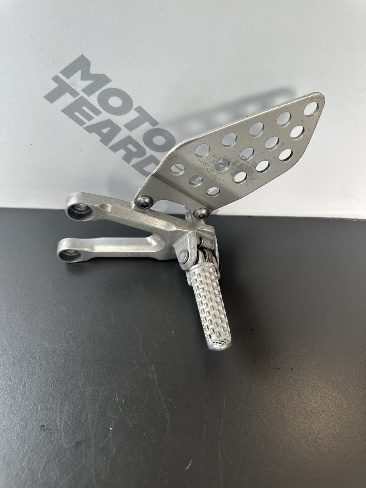 Honda CBR1000RR fireblade left front footrest hanger bracket peg 2004 - 2005 OEM