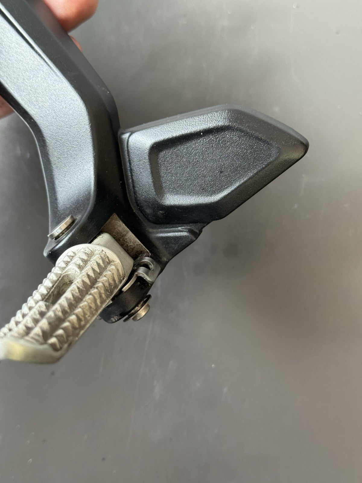 TRIUMPH TRIDENT 660 Left Rear Footrest Hanger - T2086605 2021-2024 Left Footrest