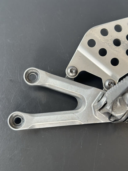 Honda CBR1000RR fireblade left front footrest hanger bracket peg 2004 - 2005 OEM