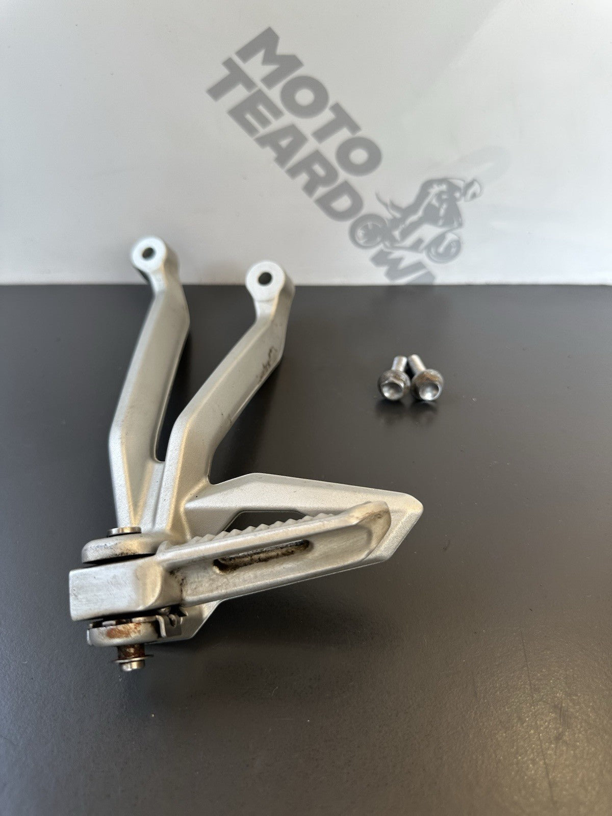 TRIUMPH STREET TRIPLE Left Pillion Footrest Hanger - 765R 765RS T2081987 2017-19