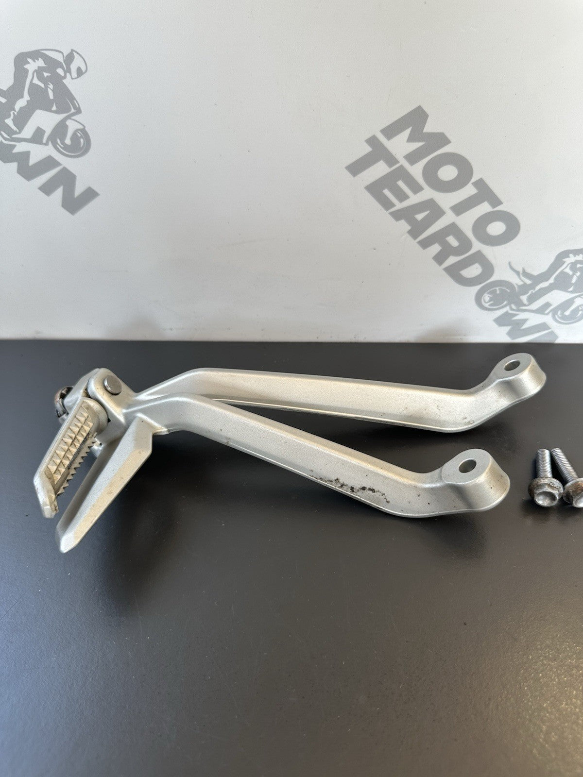 TRIUMPH STREET TRIPLE Left Pillion Footrest Hanger - 765R 765RS T2081987 2017-19