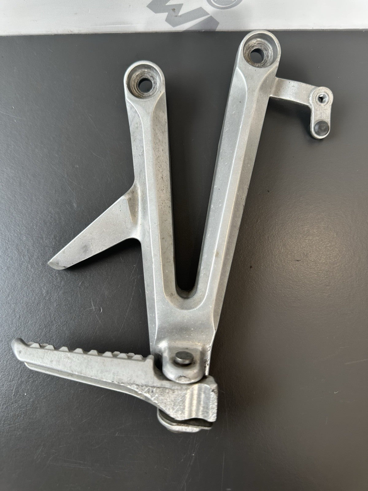 Honda CBR1000RR Fireblade right pillion footrest Right Foot Hanger 2004-2005 OEM