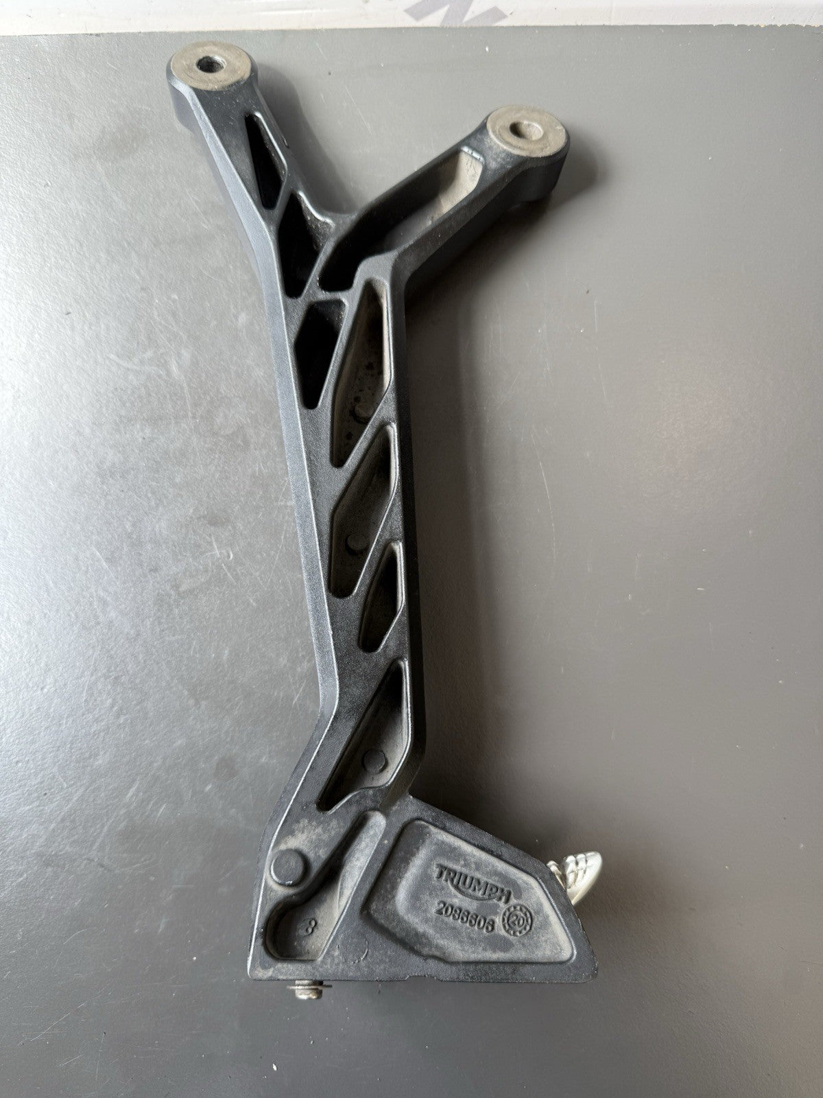 TRIUMPH TRIDENT 660 Right Rear Footrest Hanger - T2086606 2021-2024 RT Footrest